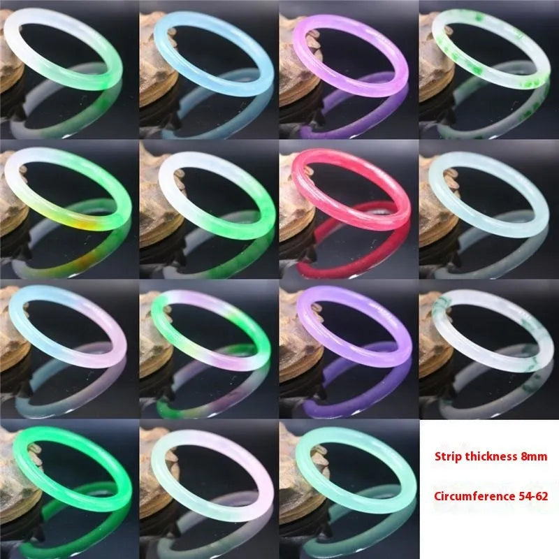 Jade bracelet with floating flower design in ice-like emerald tones and auspicious patterns