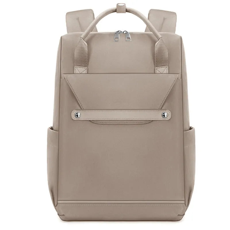 Lightweight large capacity schoolbag in solid colour nylon with waterproof finish for girls and travel