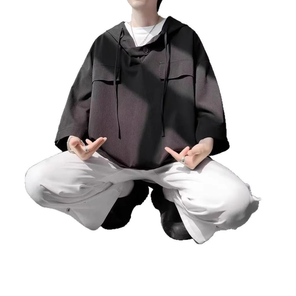 Man wearing a hooded short sleeve t-shirt in lightweight polyester fabric for summer
