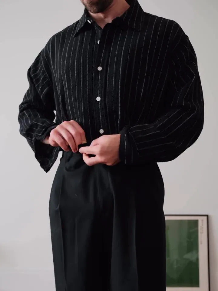 Black pinstriped button-down shirt with regular fit and traditional collar on mannequin