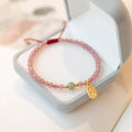 Red rope bracelet with strawberry quartz and garnet beads in hand-woven women's design
