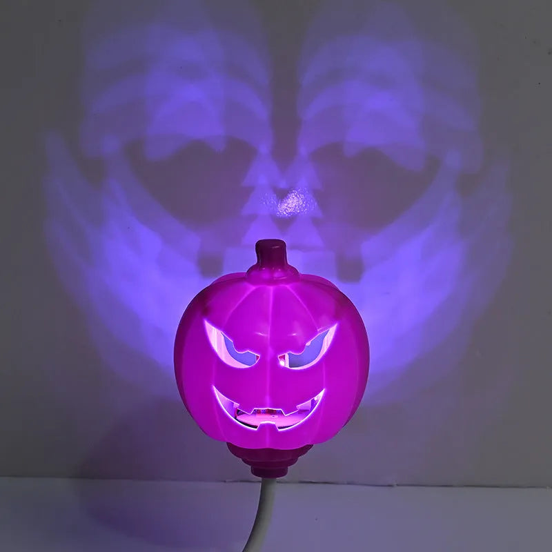 Plastic pumpkin lamp with USB cable showing yellow and purple light options
