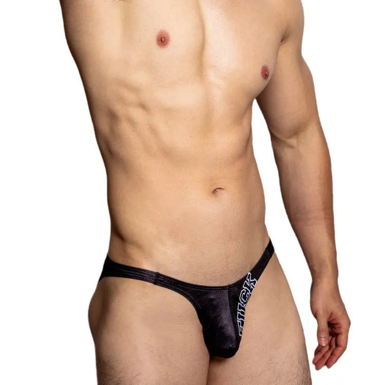 Low waist briefs for couples in white, black, or orange polyester with letter detail and small triangle cut.