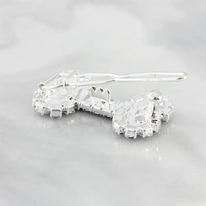 Dog bone pet barrette in size S with diamond accent, shown in white, pink, blue, and red colour options