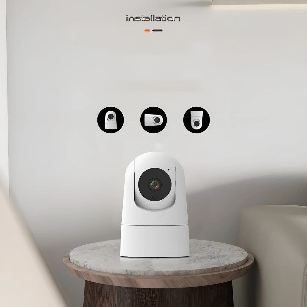 White indoor pan tilt security camera with microphone and speaker for two-way voice on a desk.