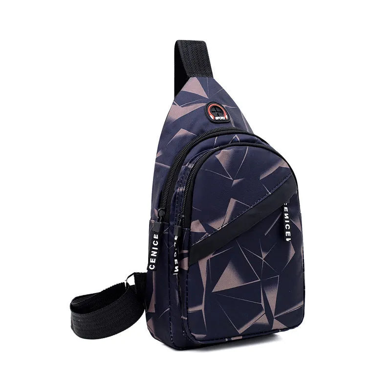 Men's medium blue Oxford cloth crossbody bag showing earphone hole and zipper opening.