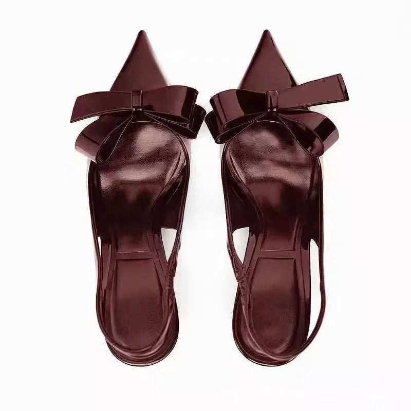 Wine red patent leather open-back high heels with bow detail and rear lacing