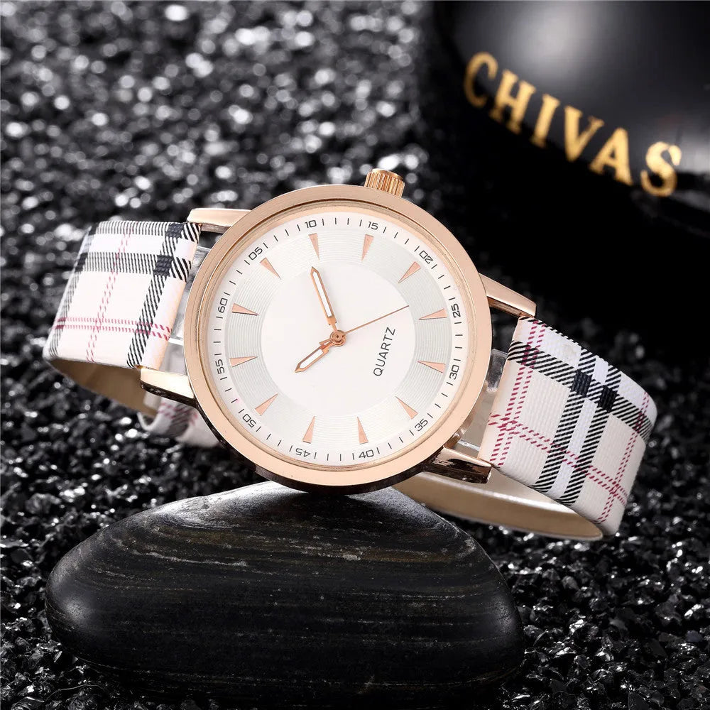 Gold black women's leather strap quartz watch with round 32mm dial and slim 6mm case