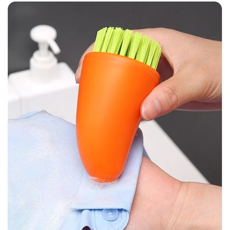 Carrot-shaped orange kitchen brush with nylon bristles for cleaning vegetables