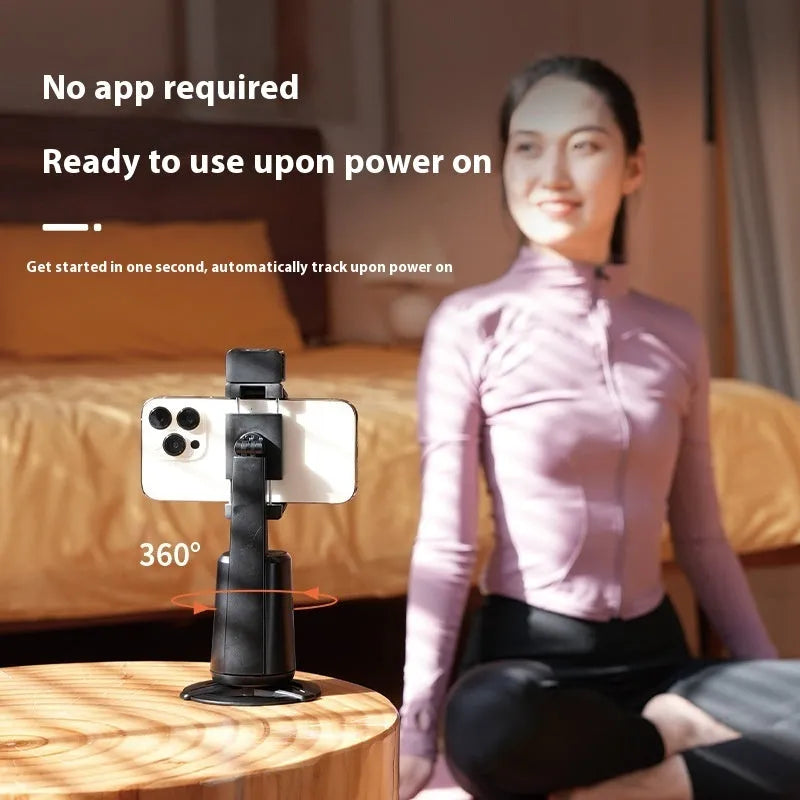 Black desktop phone bracket with face tracking, rotating camera head, and ribbon lighting for mobile phones