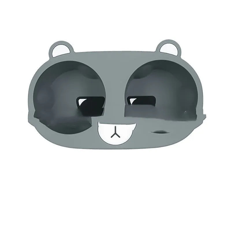 A grey silicone insert designed for a car centre console cup holder.