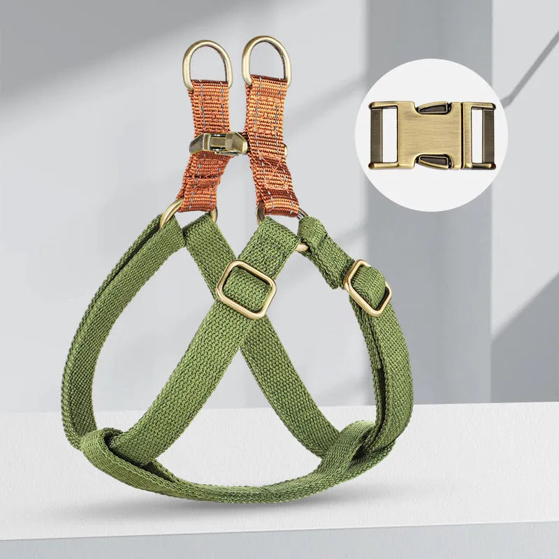 Brown vest-style dog leash on small dog showing chest strap and alloy fastener