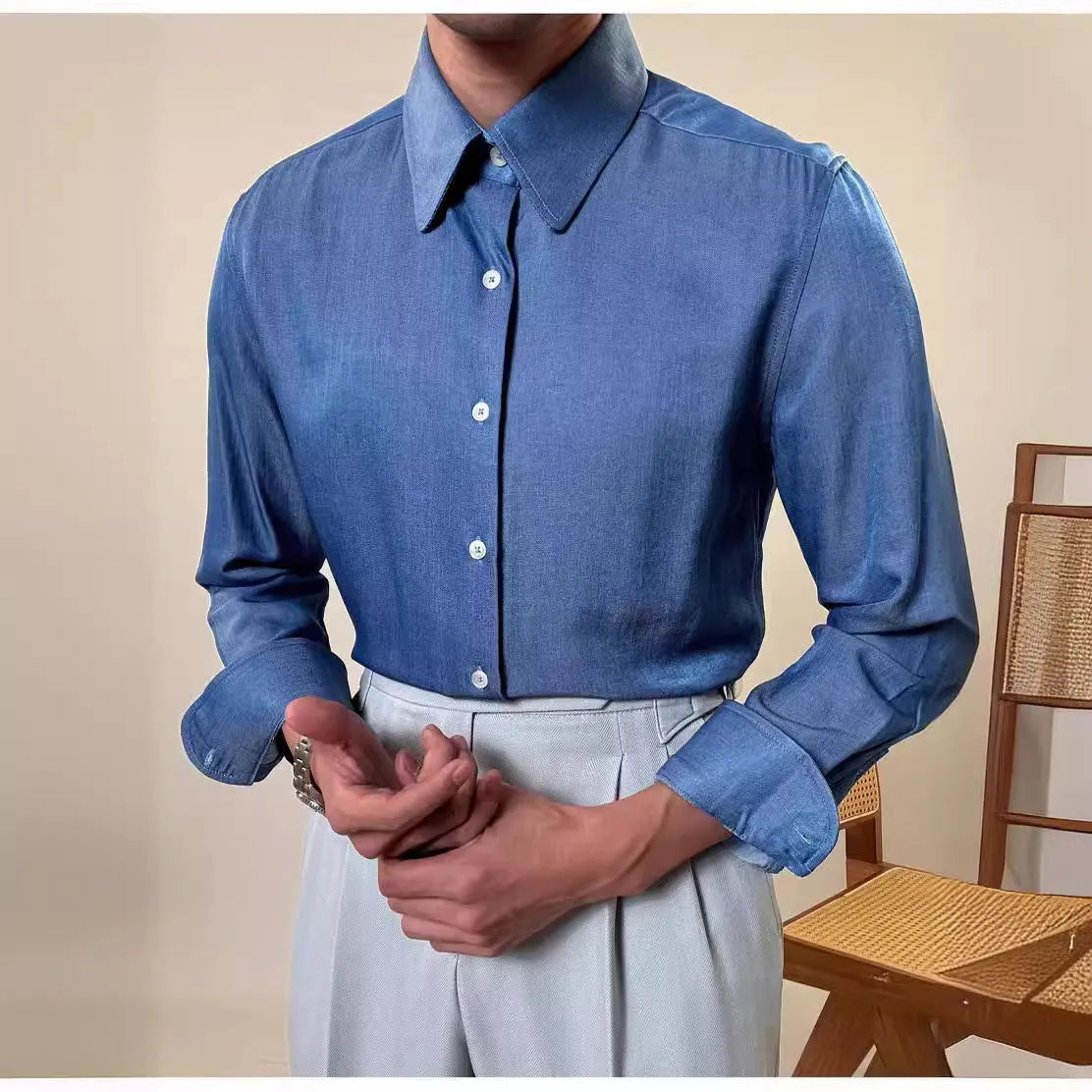 Men's blue slim fit long sleeve shirt with round collar shown in business casual styling