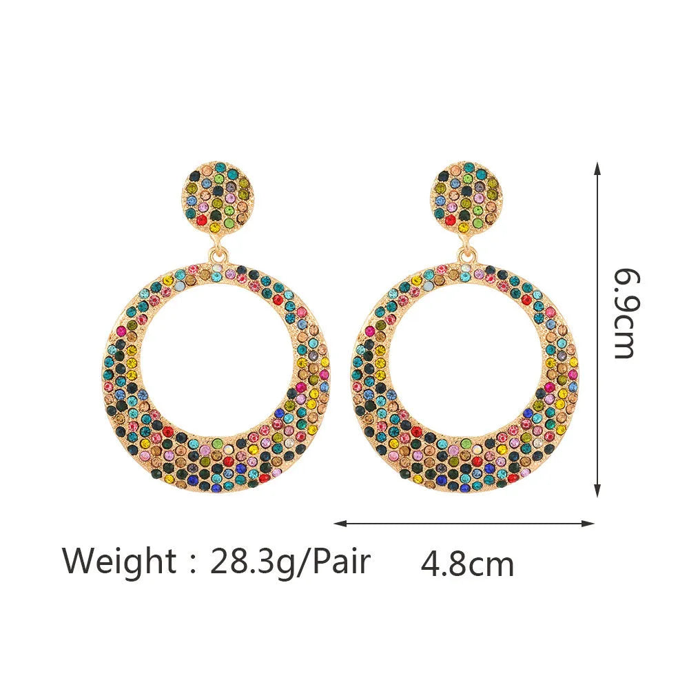 Colourful large round pendant drop earrings with cartoon style and diamond accents on metal alloy.