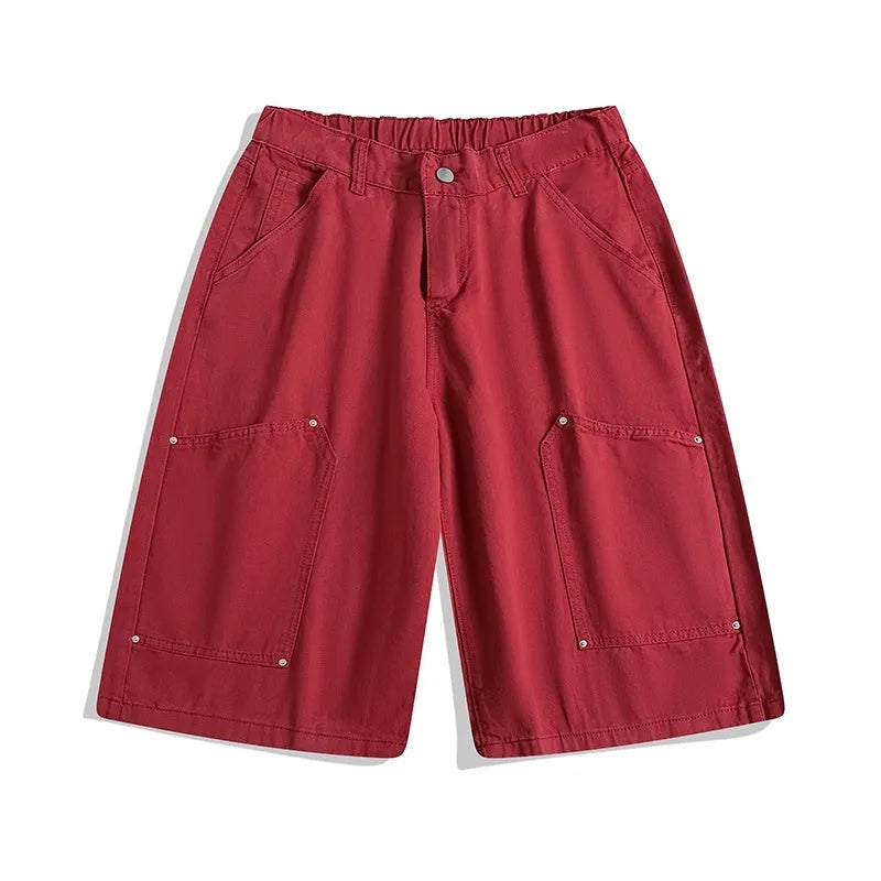 Workwear-style cropped pants with wide-leg design in apricot colour showing mid waist and loose fit