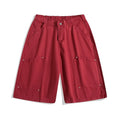 Workwear-style cropped pants with wide-leg design in apricot colour showing mid waist and loose fit