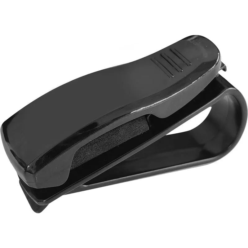 Black plastic clip for car sunshade holding sunglasses and an ID card
