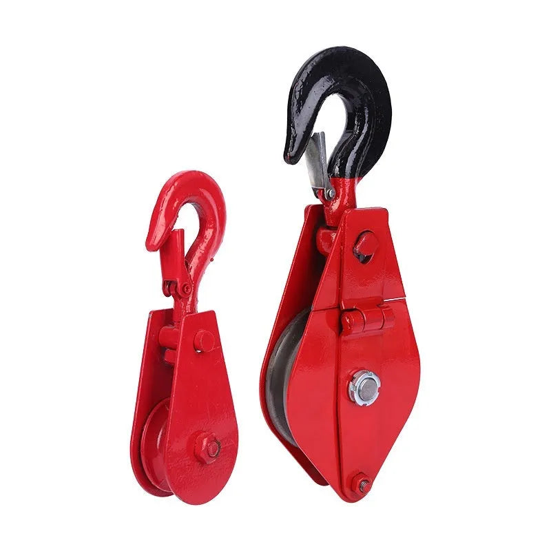 Red industrial steel lifting pulley with a large safety latch hook for wire rope or sling connection.