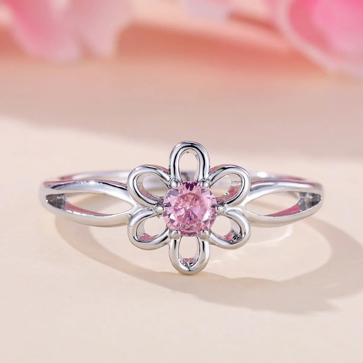 Copper fashion ring with hollowed flower design in platinum pink diamond colour