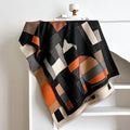 Beige imitation cashmere scarf draped to show its 185cm length and 65cm width.