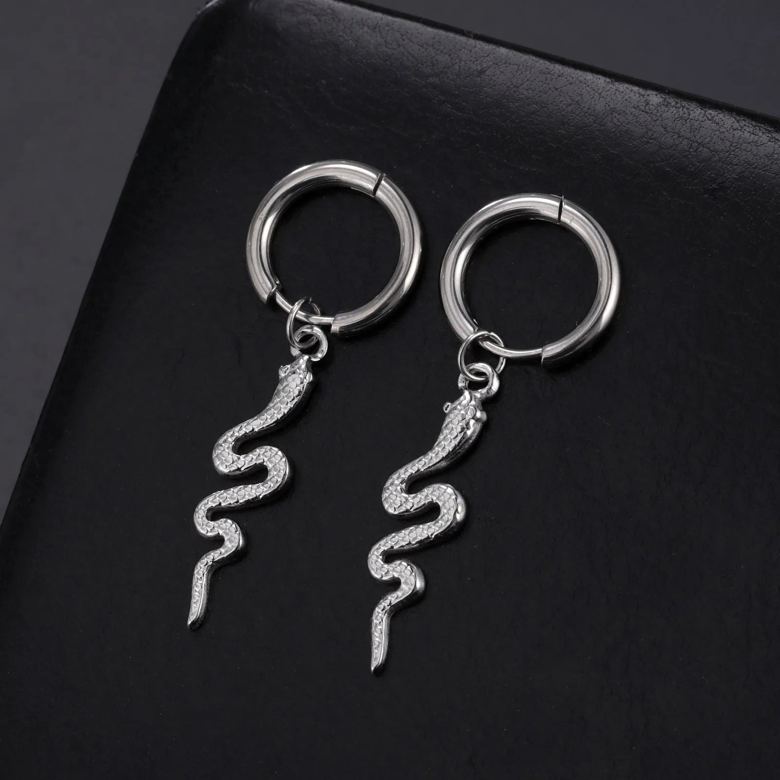 Gold snake clip-on earrings in vintage animal zodiac design