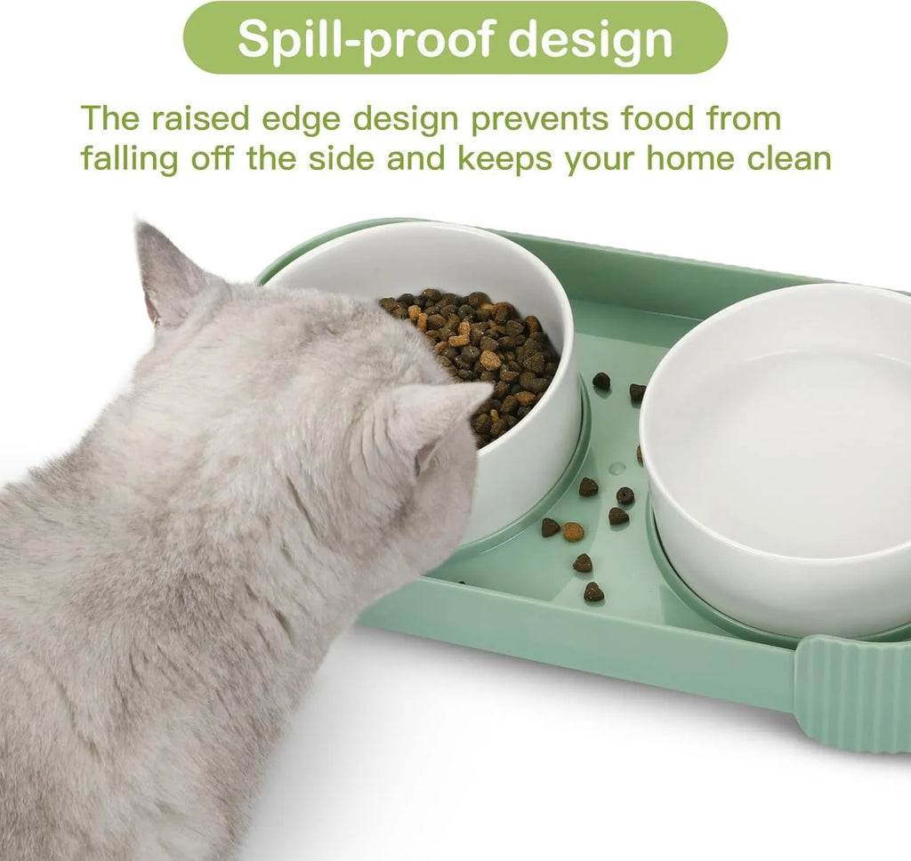 Green ceramic elevated cat bowl set with two bowls on a tilted stand.