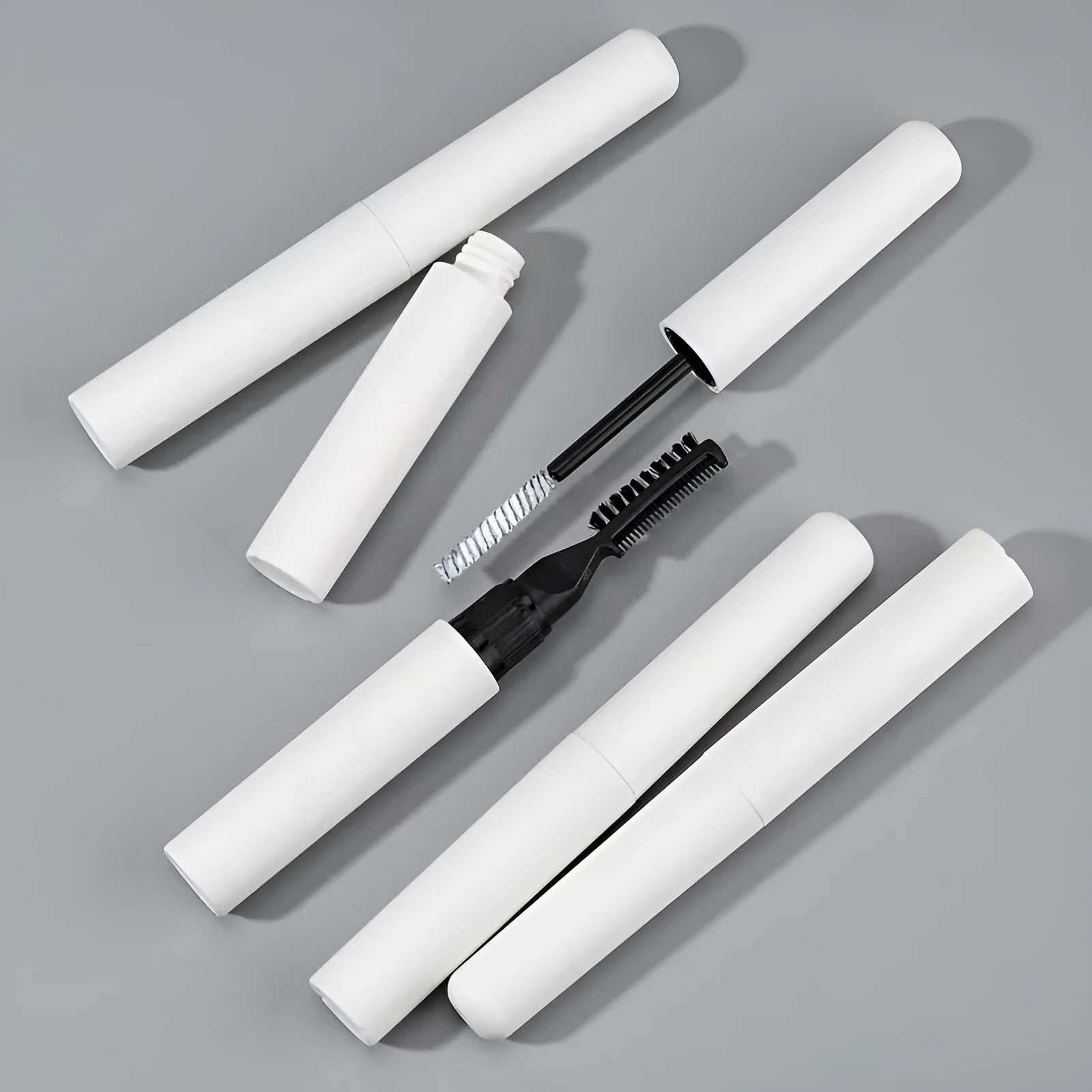 Eyebrow gel with brush applicator for natural brow shaping in white or pink colour options