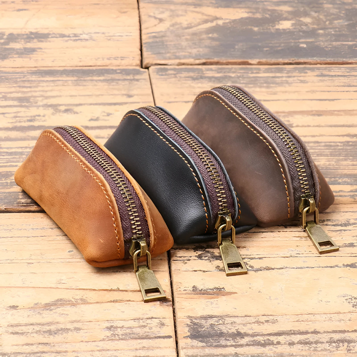 Men's leather clutch coin purse in first layer cowhide with chain, shown in brown yellow, dark brown or black