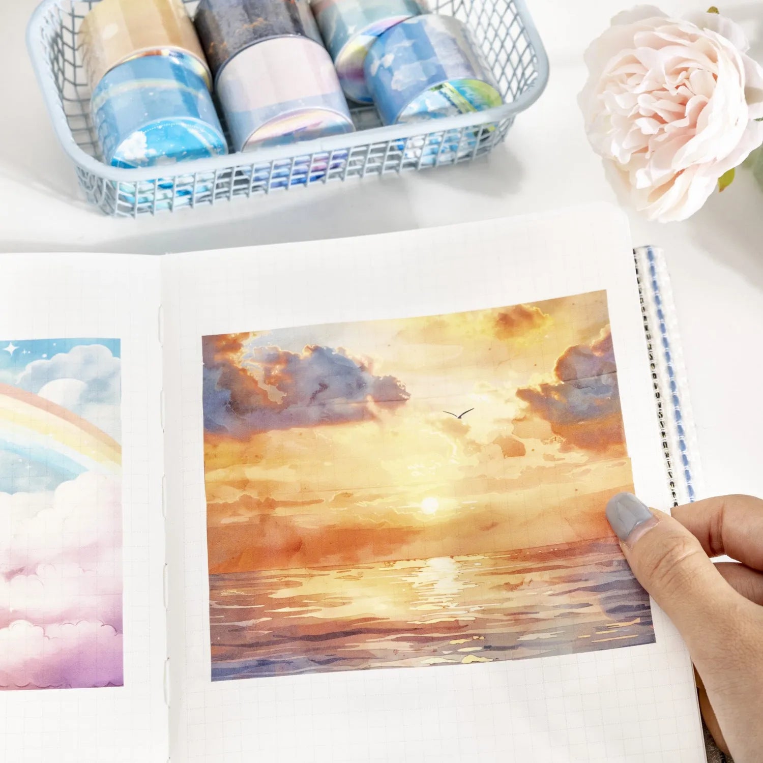 Roll of Japanese washi tape with sky theme designs including clouds, sun, moon, and nebula on a 30mm wide format.