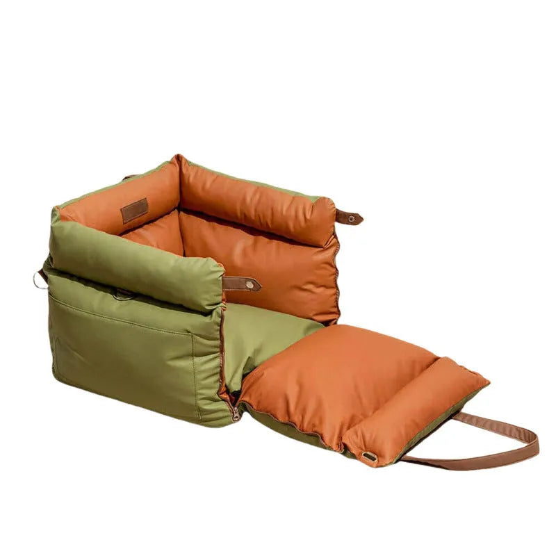 Green waterproof removable dog car nest bed with sides, shown on a car boot floor.