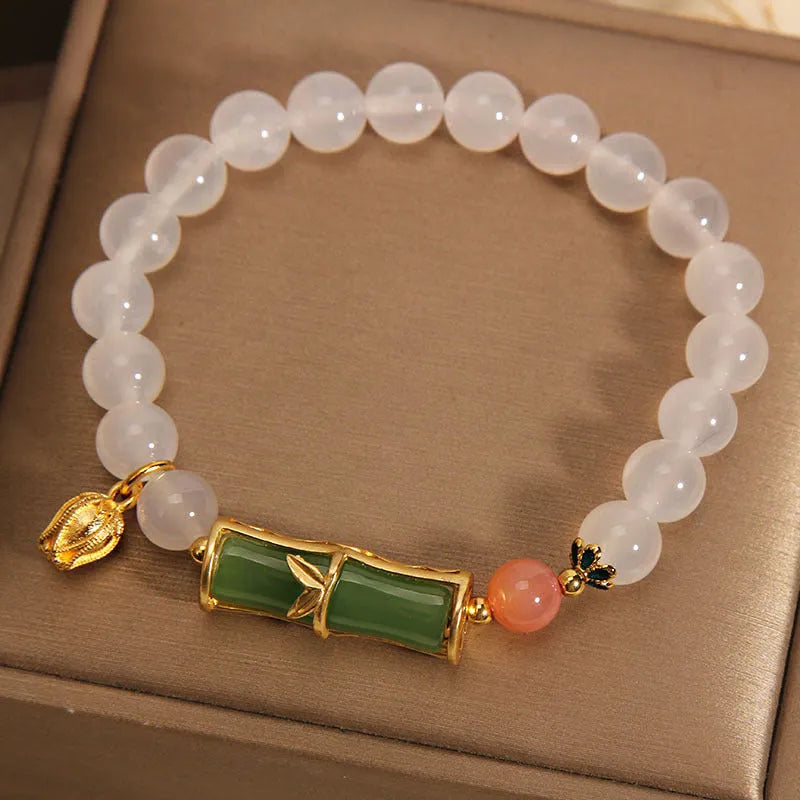 Women's white agate jade bead bracelet with bamboo joint beading in a retro Chinese style.