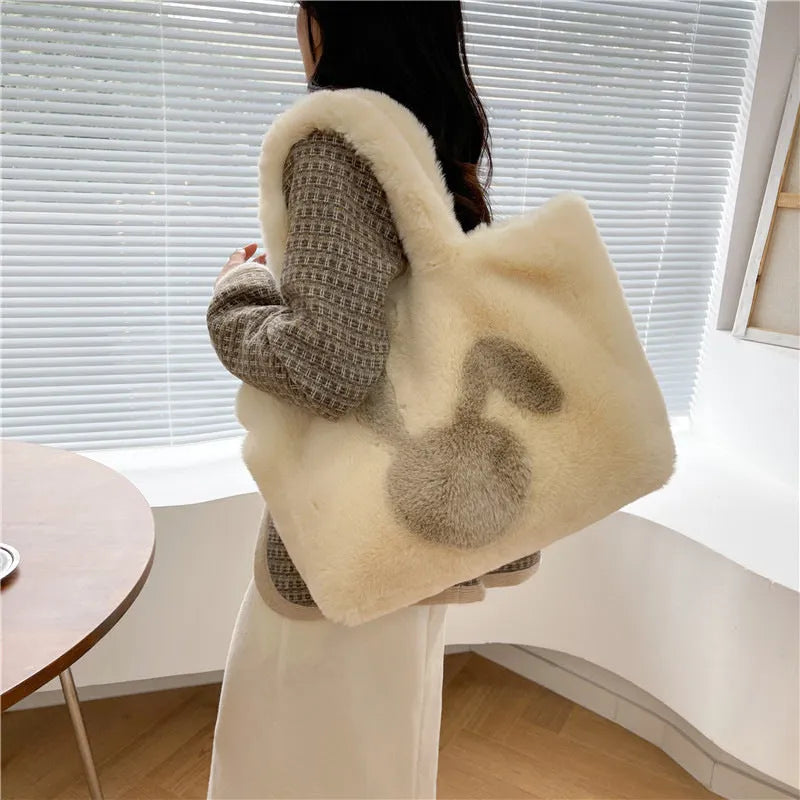 Cartoon rabbit ears design on a solid colour plush tote bag for women.