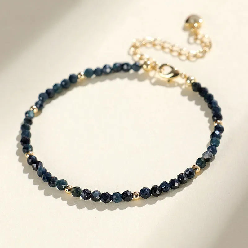 Close-up of a blue tourmaline and spacer bead bracelet for women.