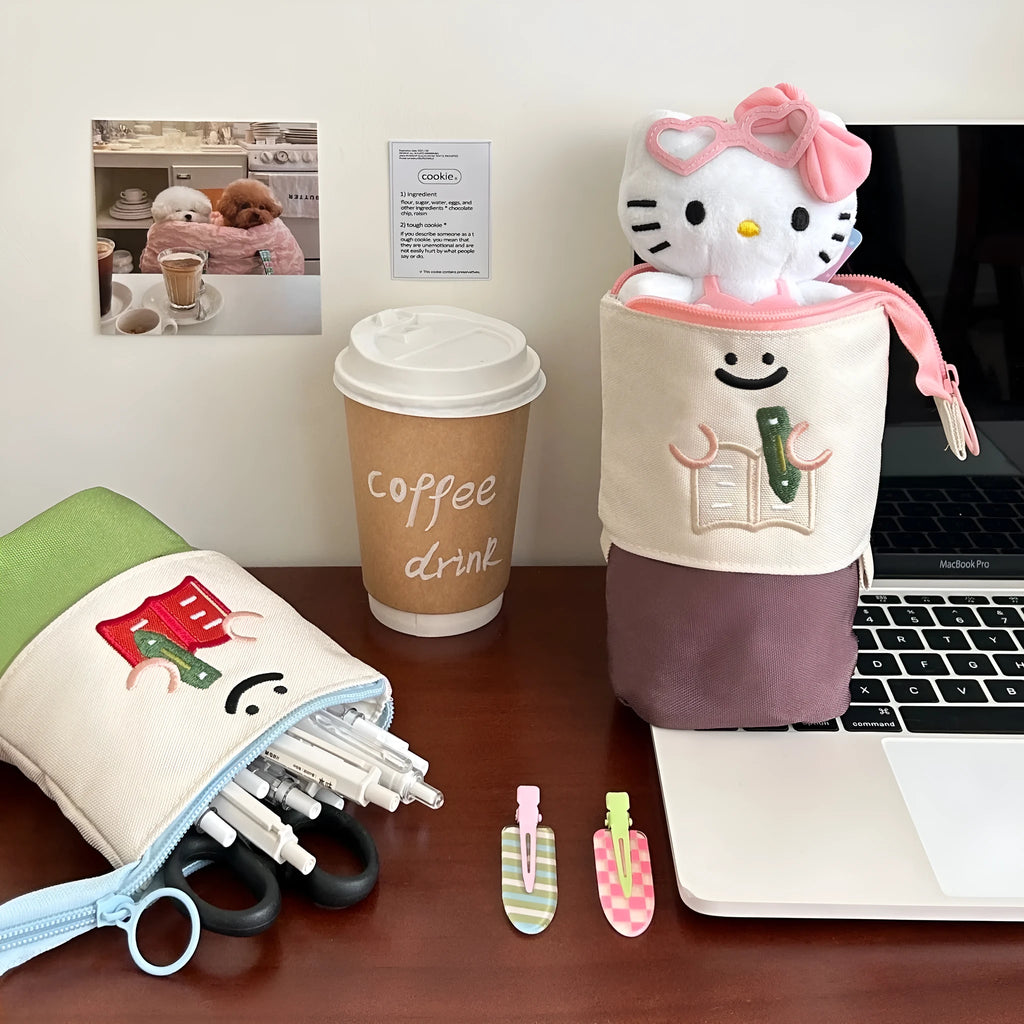 Brown collapsible pencil case with cartoon print, showing 17cm by 14cm size.