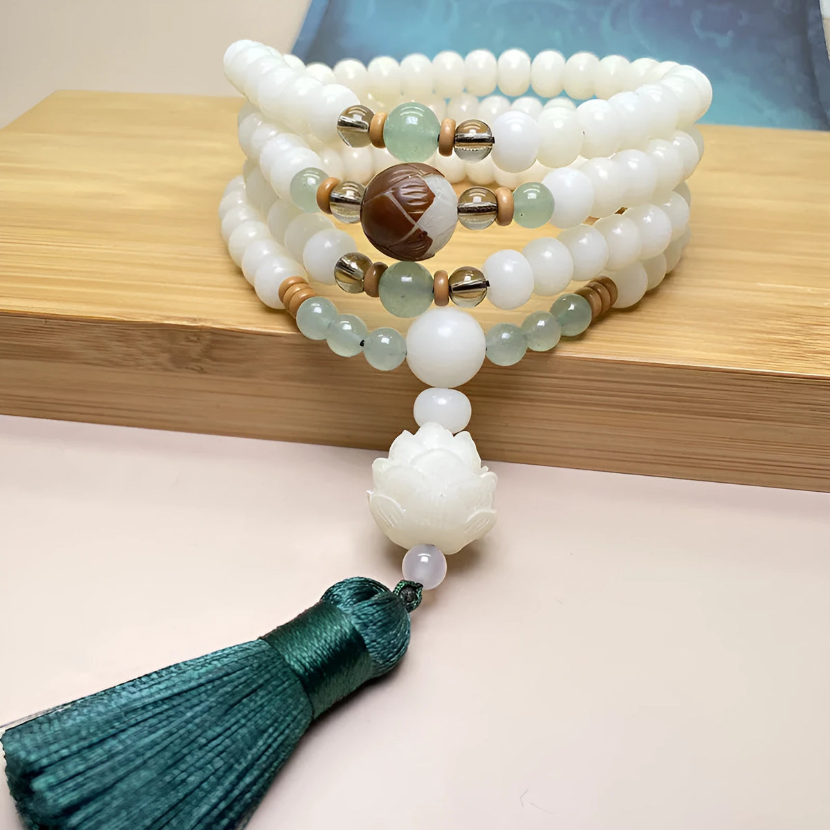 White Jade Bodhi bead bracelet with 108 beads in three pattern styles.