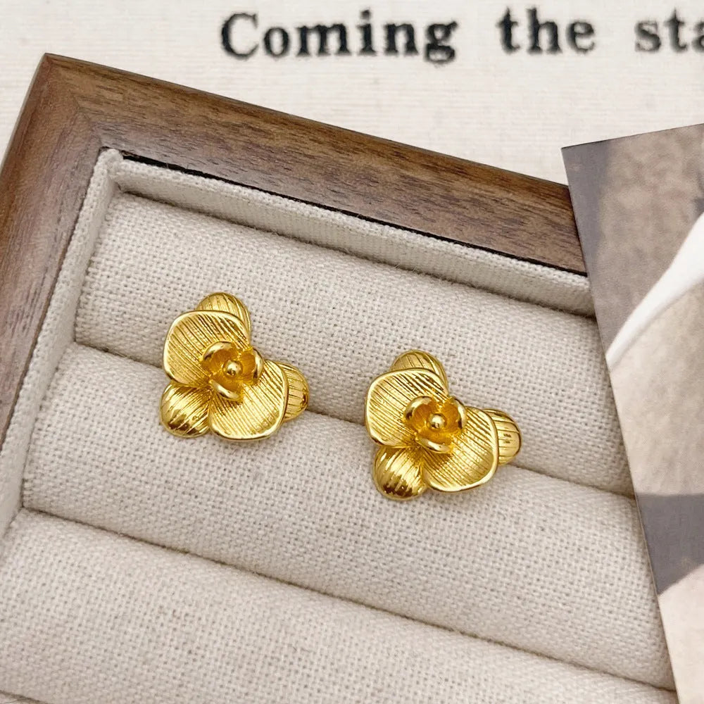 Women's retro floral copper earrings with electroplated gold or silver finish showing petal flower design