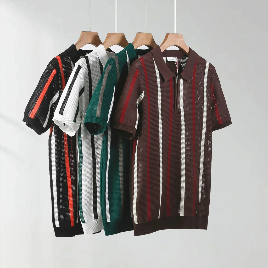 Man modelling a loose fit black knitted polo shirt with a zipper decoration and short sleeves.