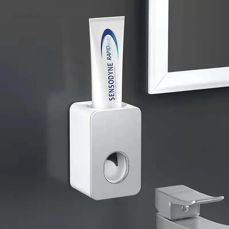 Wall-mounted automatic toothpaste dispenser with punch-free fixing, shown in black, grey, pink, green and white options