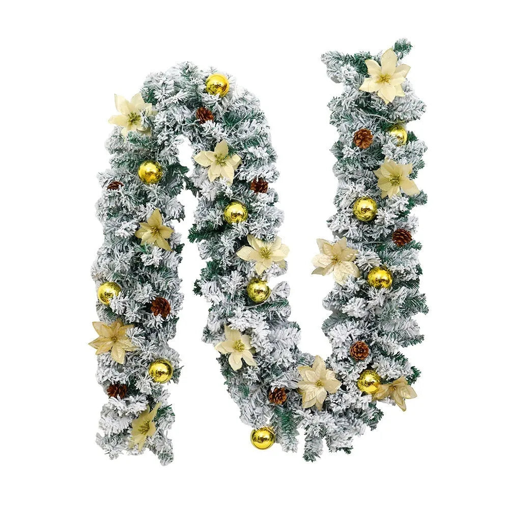 A long, flocked golden rattan Christmas garland draped in a swag on a mantelpiece.