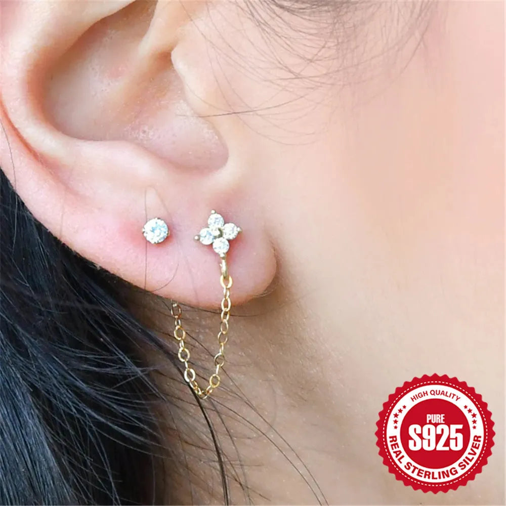 S925 sterling silver ear stud with flower, chain, and tassel detail in a golden electroplated finish.