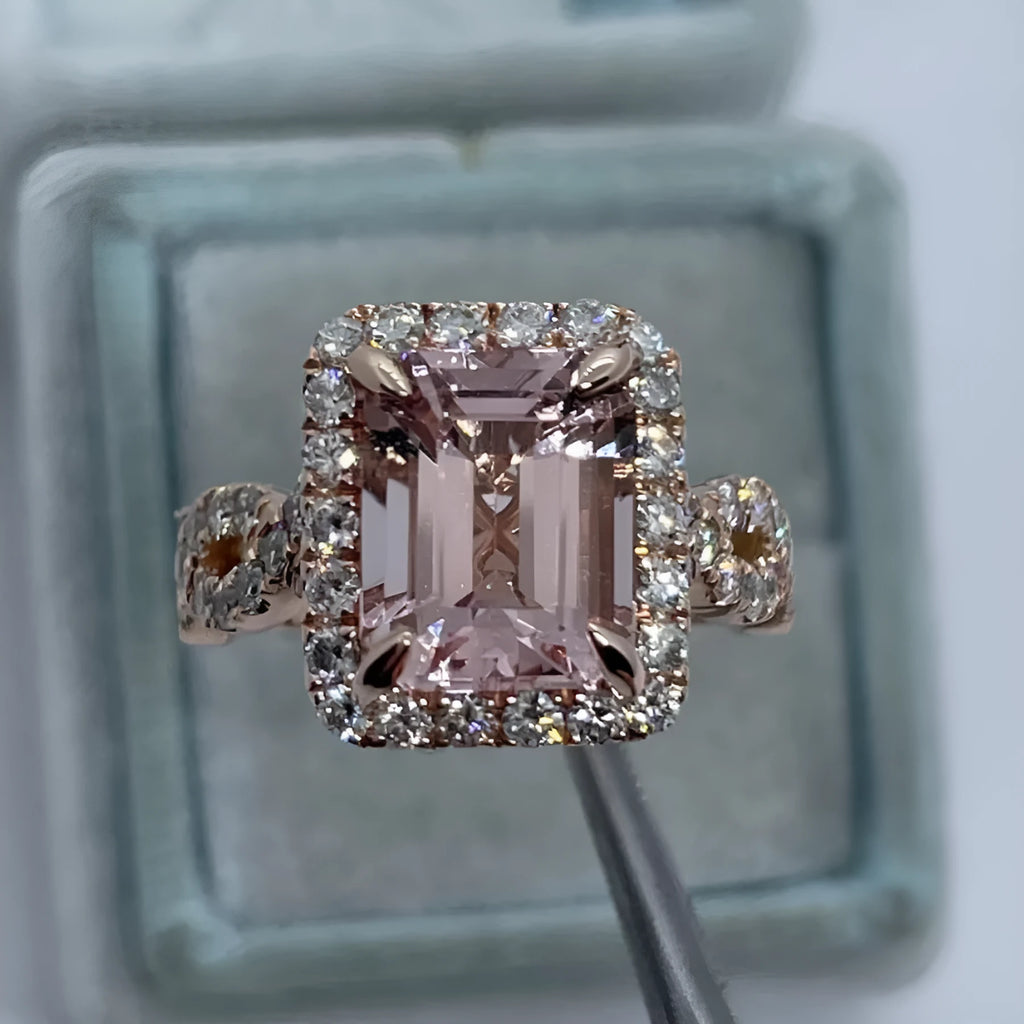 Geometric rose gold alloy ring on a plain background showing its shape and electroplated finish.
