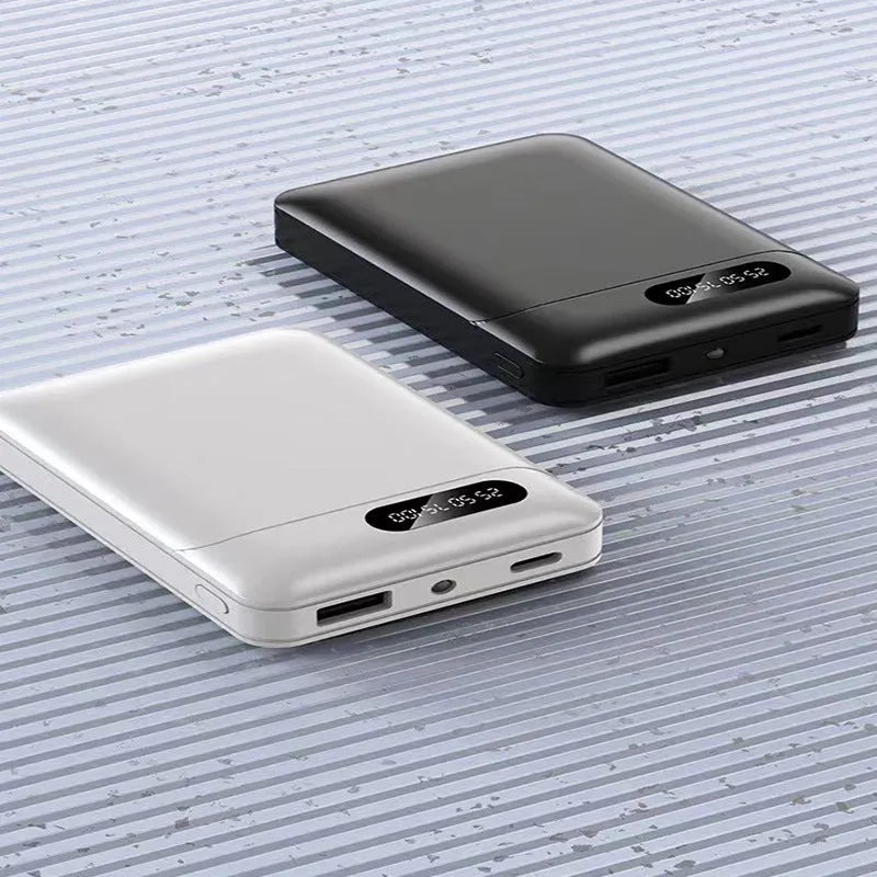Black and white portable power bank showing compact rectangular design with USB ports