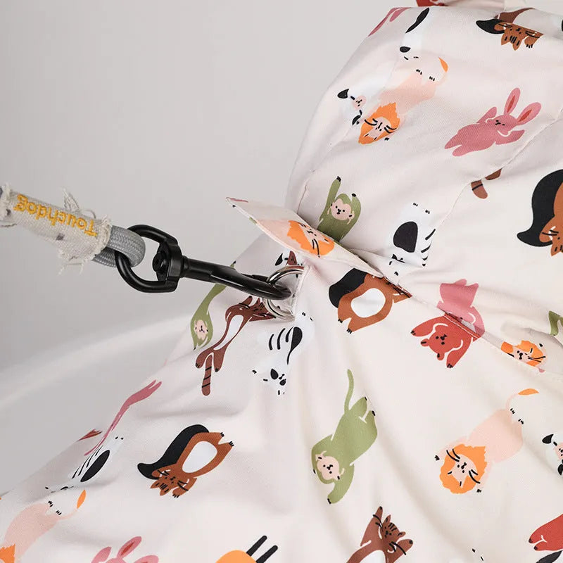 Beige dog raincoat with a cartoon animal print, showing sizing options for waterproof pet wear.