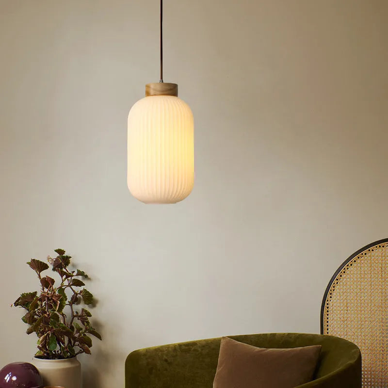 Retro Nordic style wooden pendant ceiling light with a choice of three sizes and three light colours.