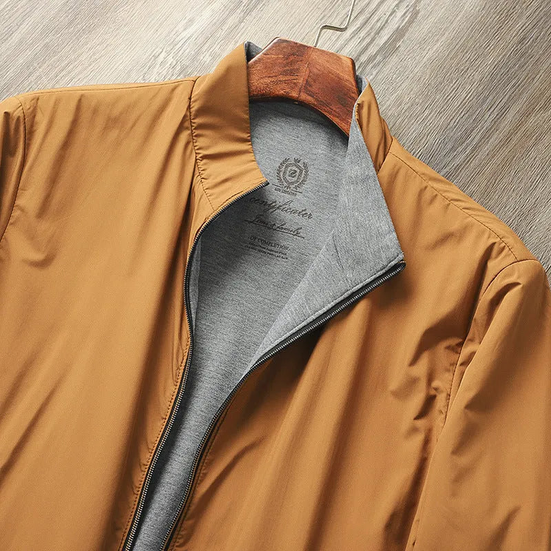 Men's plain stand collar jacket in a polyester cotton blend fabric, shown in blue.