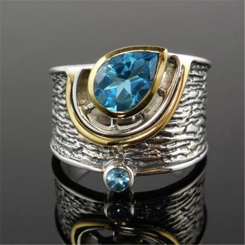 Blue zircon ring with drop shape design and Chinese style influences
