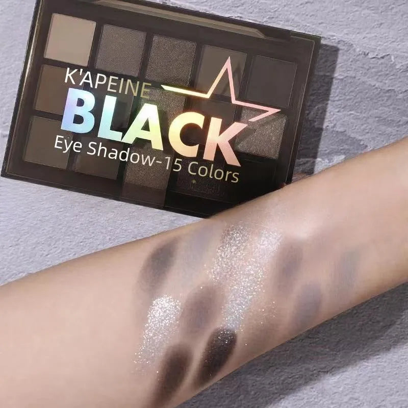 15-colour eye shadow palette showing matte and shimmer pans in brown and blue earth tones