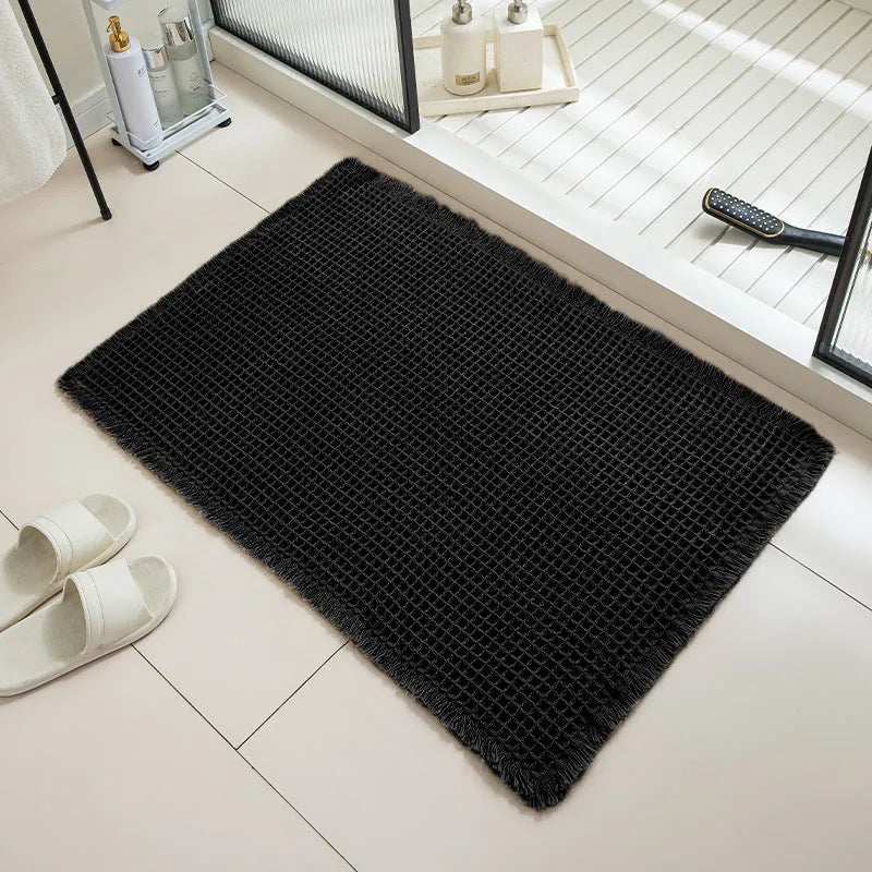 Checkered pattern non-slip absorbent bathroom carpet on a tiled floor.