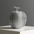 Resin craft decorative apple sculpture in black tall model with smooth finish on a white table
