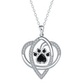 Copper necklace with cat and dog paw prints pendant on a cross chain, electroplated finish.